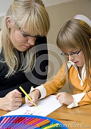 Mother and daughter drawing together Stock Photo