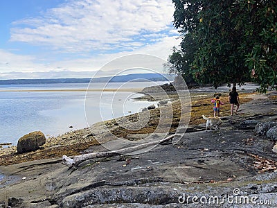 A mother and daughter exploring the beautiful shores of Tent Island, during a summer vacation in the Gulf Islands Stock Photo