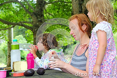 Mother daughter family picnic outdoor park Stock Photo