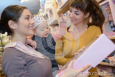 Mother daughter and friend shopping for homeware Stock Photo