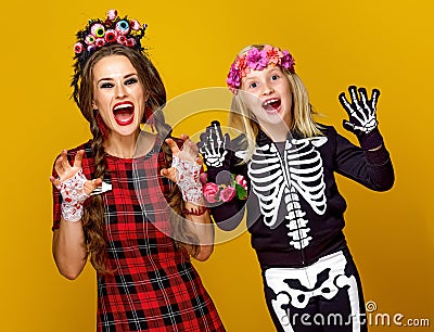 Mother and daughter in halloween costume frightening Stock Photo