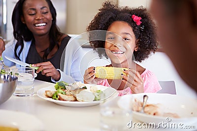 Mother And Daughter Having Family Meal At Table Stock Photo