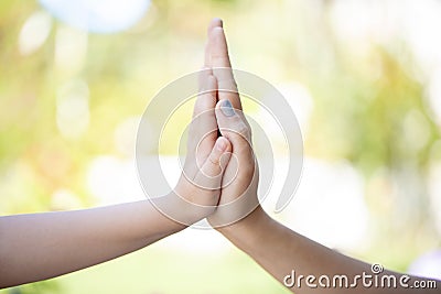 Mother and daughter high five Stock Photo