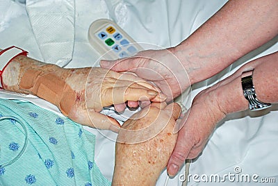 Mother Daughter Holding Hands in Hospital Stock Photo
