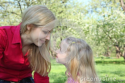 Mother and daughter look on each other Stock Photo