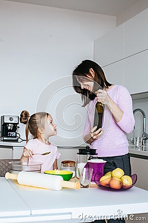 Mother And Daughter Making Cookies Stock Photo