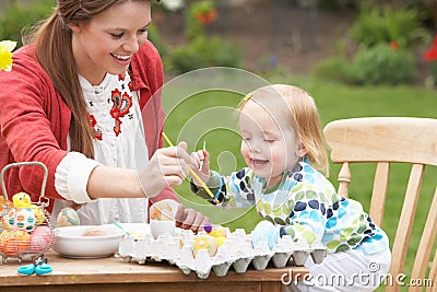 Mother And Daughter Painting Easter Eggs Stock Photo