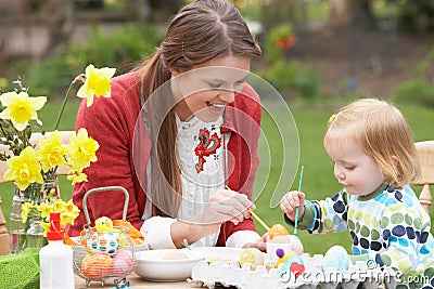 Mother And Daughter Painting Easter Eggs Stock Photo