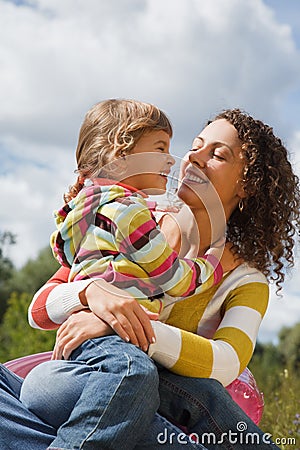 Mother and the daughter play in the open air Stock Photo