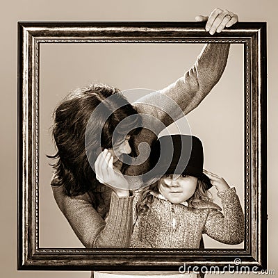 Mother And Daughter Posing With Frame Royalty-Free Stock Photo