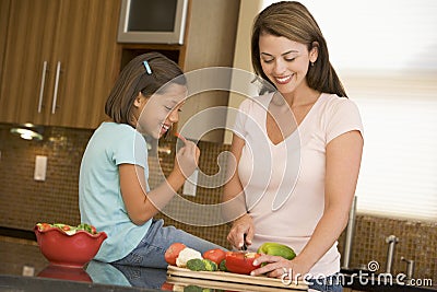 Mother And Daughter Preparing A Meal Stock Photo