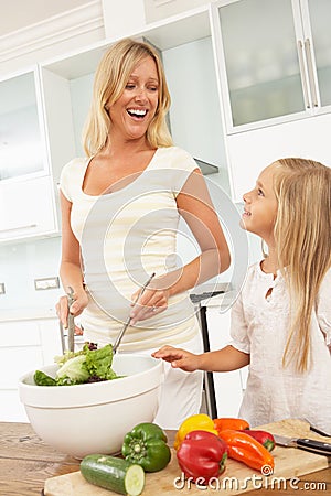 Mother & Daughter Preparing Salad Stock Photo