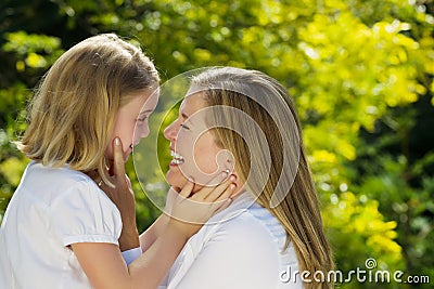 Mother and daughter sharing a moment together outdoors Stock Photo