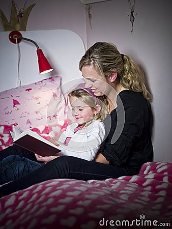 Mother and Daughter storytelling Stock Photo