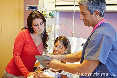 Mother And Daughter Talking To Consultant In Hospital Room Stock Photo
