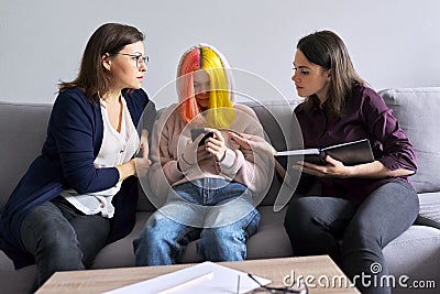 Mother and daughter teenager at consultation with psychologist, problems of adolescence Stock Photo