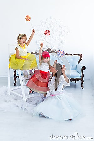 Mother and daughters with candy Stock Photo