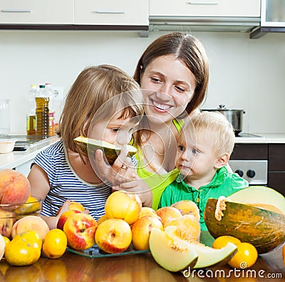 Mother with daughters over table Stock Photo