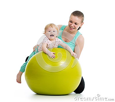 Mother doing gymnastics baby on fitness ball Stock Photo