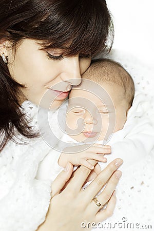 Mother embracing sleeping baby Stock Photo