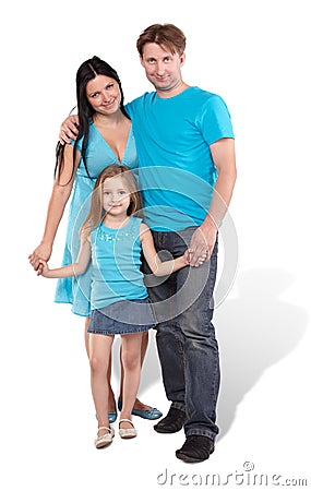 Mother, father and little daughter stand embraced Stock Photo