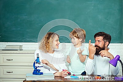 Mother father and son together schooling. Boy from elementary school. Parents encouraging their little son before the Stock Photo