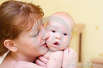 Mother gently holding baby in hands Stock Photo