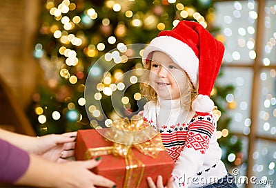 Mother gives a girl a gift Stock Photo