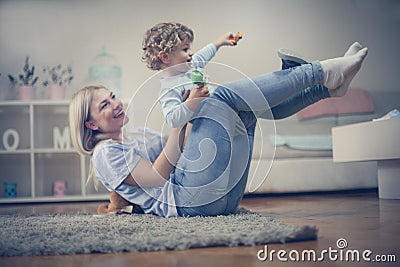 Mother have play with her little boy. On the move. Stock Photo