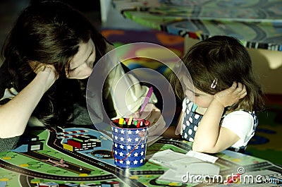 Mother and her daughter drawing together Stock Photo