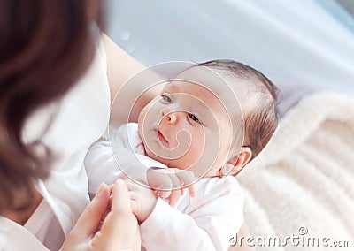 Mother with her newborn baby. Mother is holding her little baby Stock Photo