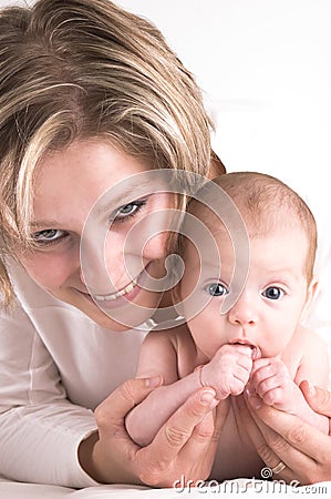 Mother and her sucking baby Stock Photo