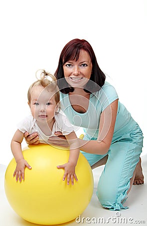 Mother hold daughter on Fitness Ball Stock Photo