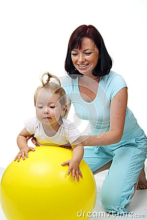 Mother hold daughter on Fitness Ball Stock Photo