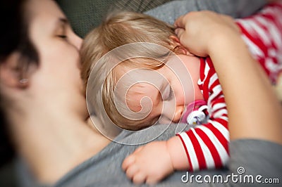 Mother hold sleeping baby Stock Photo