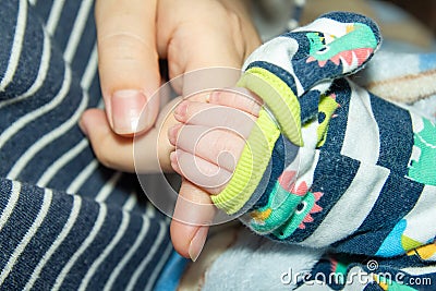 Mother holding a babys hand Stock Photo