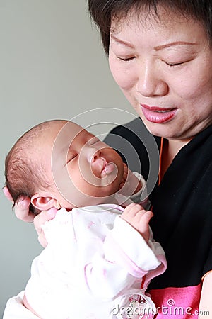 Mother holding her baby Stock Photo