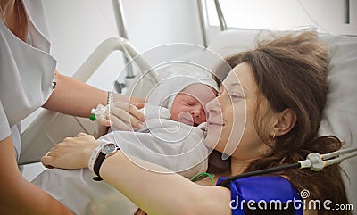 Mother holding newborn baby Stock Photo