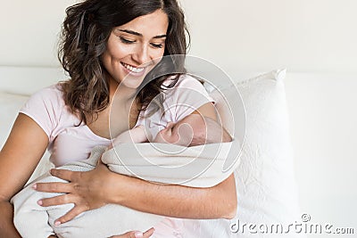 Mother holding newborn baby Stock Photo