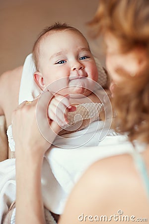 Mother holding newborn baby with smile Stock Photo