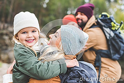 Mother holding smiling daughter Stock Photo