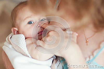 Mother holdingnewborn baby on hands and play Stock Photo