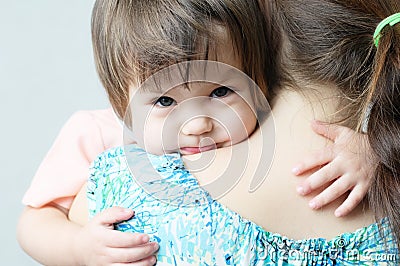 Mother hugging child, physical contact, family relationships, cuddling baby for physical affection, communicate happy daughter Stock Photo