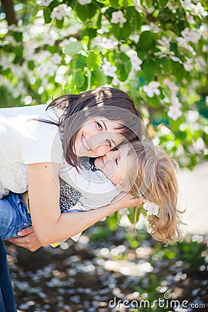 Mother hugs daughter Stock Photo