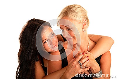 Mother hugs favorite daughter and looks at her Stock Photo