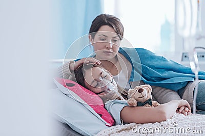 Mother and kid with cystic fibrosis Stock Photo