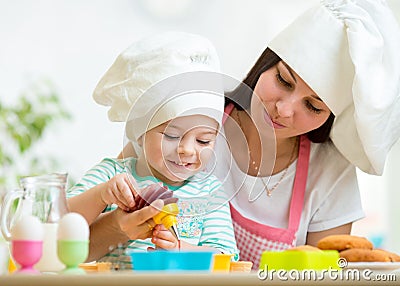 Mother and kid girl making cookies Stock Photo