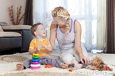 Mother and kid have pastime together indoor Stock Photo