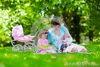 Mother and kids enjoying picnic outdoors Stock Photo