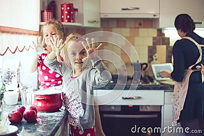 Mother with kids at the kitchen Stock Photo